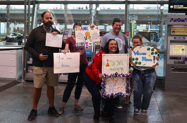 SAN DIEGO (Oct. 16, 2025) – Loved ones greet Navy Expeditionary Medical Unit 10 Gulf (EMU-10G) Sailors at San Diego International Airport after the unit's return from a deployment to the Middle East. The EMU delivered advanced treatment close to the field, ensuring timely and effective medical care for personnel operating in the region, accelerating warfighter recovery to get back to the fight. (U.S. Navy photo by Arsenio R. Cortez Jr.)