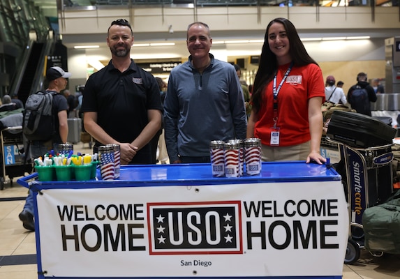 SAN DIEGO (Oct. 16, 2025) – Rear Adm. Kevin Brown, commander of Naval Medical Forces Pacific, thanks United Service Organizations staff for their support in welcoming Navy Expeditionary Medical Unit 10 Gulf Sailors home at San Diego International Airport. The USO played a key role in providing a comfortable and supportive environment for returning service members and their families. (U.S. Navy photo by Arsenio R. Cortez Jr.)