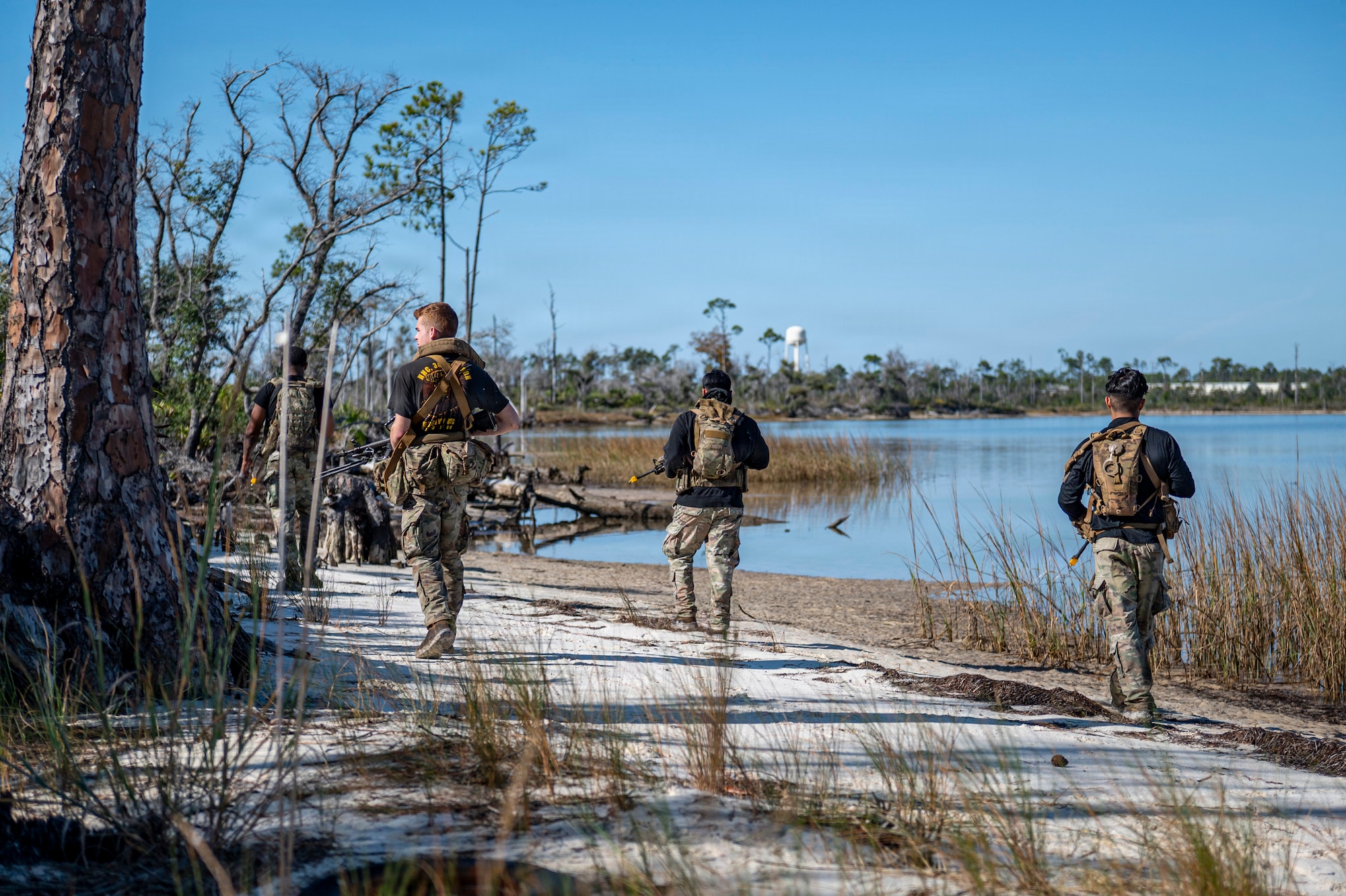 U.S. Air Force Airmen assigned to the 822nd Base Defense Squadron patrol during Exercise MOSAIC TIGER 26-1 at Tyndall Air Force Base, Georgia, Nov. 19, 2025. The team’s ability to blend reconnaissance, infiltration and disruptive attacks tested 23d Wing Airmen’s ability to detect and counter threats before they reached critical assets. (U.S. Air Force photo by Senior Airman Leonid Soubbotine)