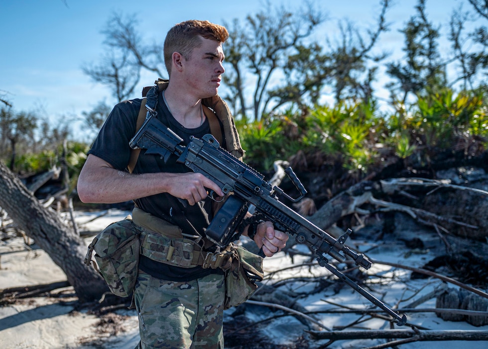 U.S. Air Force Airman 1st Class Nicholas Rich, 822nd Base Defense Squadron fire team member, patrols during Exercise MOSAIC TIGER 26-1 at Tyndall Air Force Base, Georgia, Nov. 19, 2025. Serving as the opposing force, 822d BDS Airmen created realistic threats that helped Moody Airmen practice identifying and responding to enemy activity. (U.S. Air Force photo by Senior Airman Leonid Soubbotine)