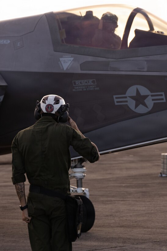 A U.S. Marine with Marine Fighter Attack Squadron (VMFA) 225, U.S. Marine Corps Forces, South, salutes a U.S. Marine Corps F-35B Lightning II pilot with VMFA-225 at Jose Aponte de la Torre Airport in Ceiba, Puerto Rico, Nov. 17, 2025. U.S. military forces are deployed to the Caribbean in support of the U.S. Southern Command mission, Department of War-directed operations, and the president’s priorities to disrupt illicit drug trafficking and protect the homeland. (U.S. Marine Corps photo)