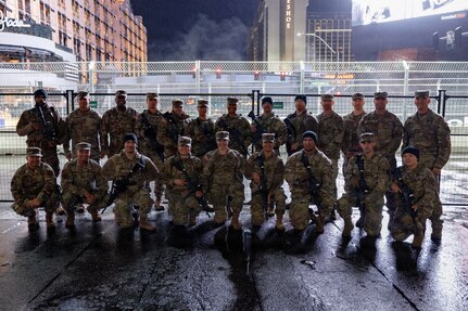 U.S. Army Soldiers attached to B Company, 422nd Expeditionary Signal Battalion - Expeditionary, pose for a photo with Brig. Gen. D. Rodger Waters (back right), the Adjutant General of the Nevada National Guard at the Formula 1 Las Vegas Grand Prix in Las Vegas, Nevada, Nov. 21, 2025.
