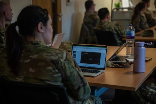airmen prepare a presentation