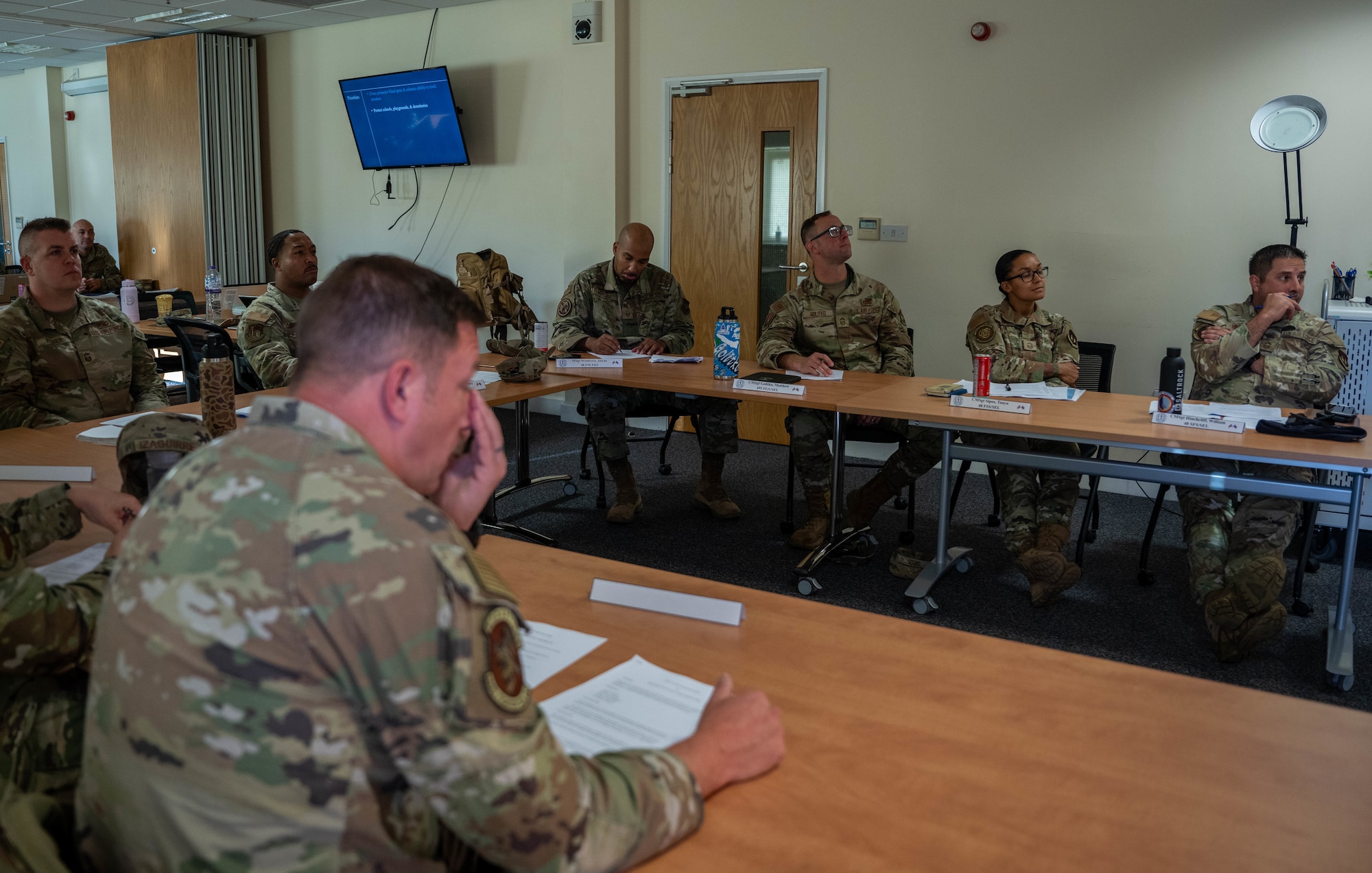 Senior Enlisted Leaders sit on a board presentation