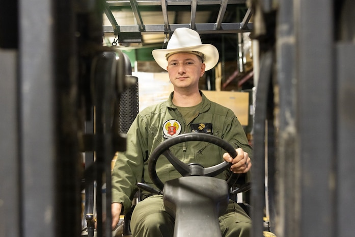 U.S. Marine Corps Lance Cpl. Asher Mabe, an airframes mechanic with Marine Heavy Helicopter Squadron 464, Marine Aircraft Group 29, 2nd Marine Aircraft Wing, Marine Corps Air Station (MCAS) New River poses for a photo on MCAS New River in Jacksonville, North Carolina, Nov. 18, 2025. Mabe, the recipient of the MCAS New River Go-Getter award for the month of November, enlisted in the Marine Corps in 2021 from Courtney, North Carolina. (U.S. Marine Corps photo by Lance Cpl. Erica S. Padgett)