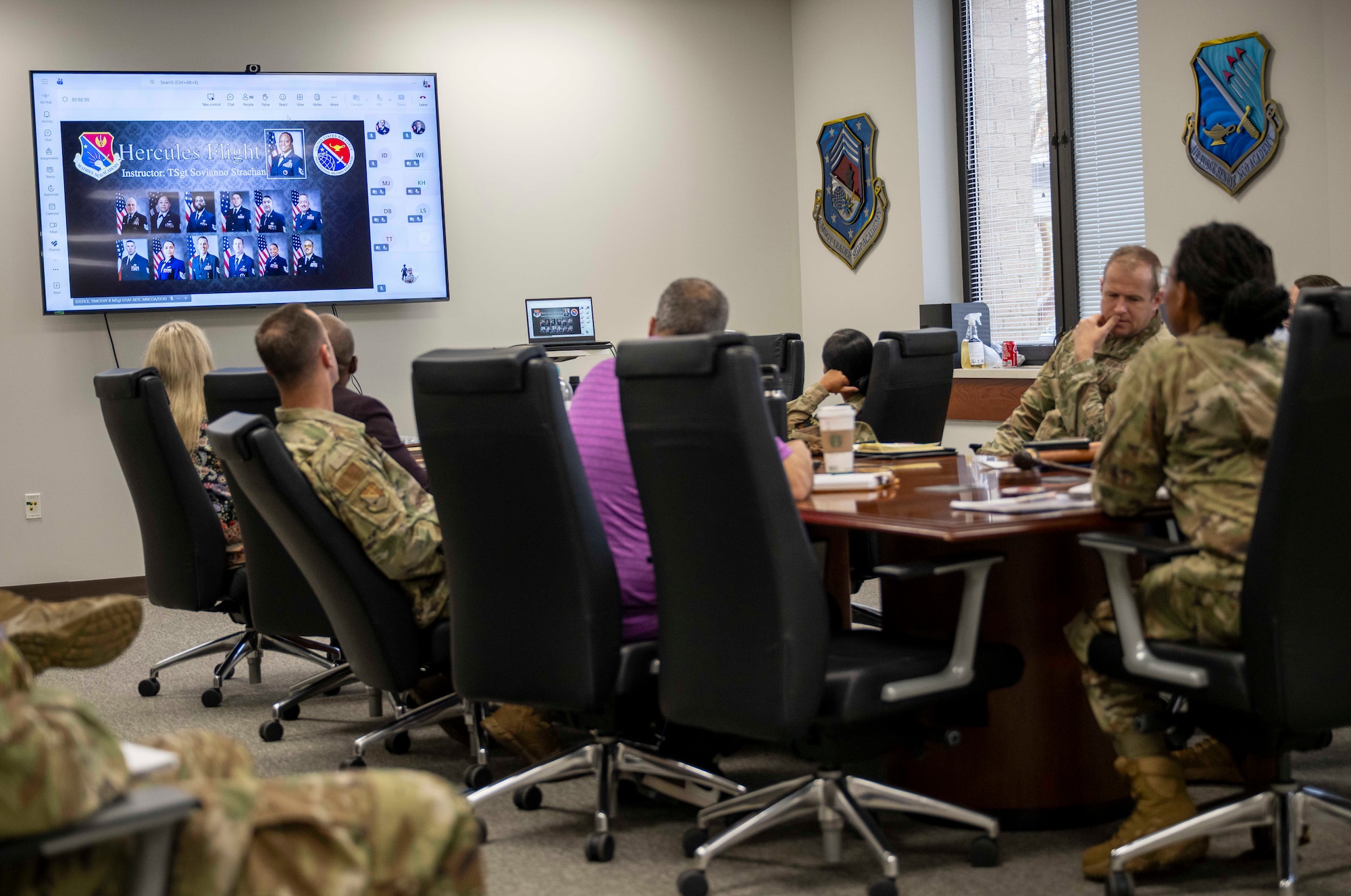 Barnes Center for Enlisted Education staff at Maxwell Air Force Base, Ala., watch the graduation of the virtual in-residence course from the Mathies Noncommissioned Officer Academy at Keesler Air Force Base, Miss., Nov. 19, 2025. The Barnes Center shifted its enlisted professional military education courses from in-residence to virtual in-residence during the government shutdown to mitigate negative impacts to Airmen. (U.S. Air Force photo by Brian Ferguson)