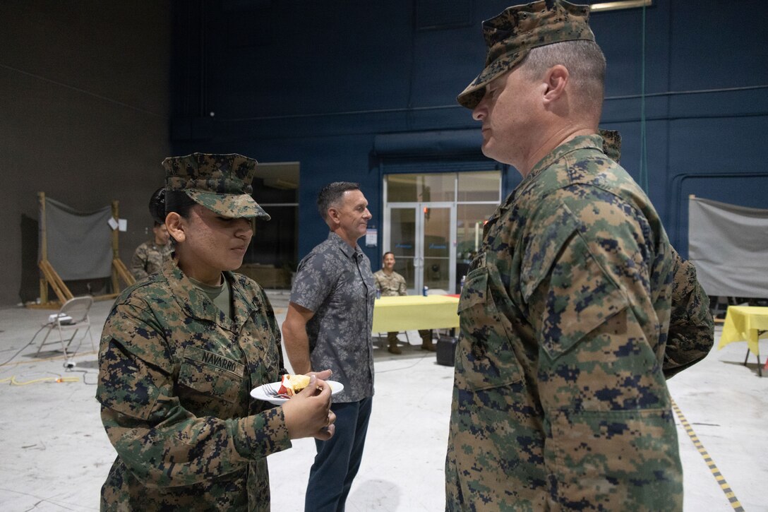The youngest Marine of Marine Fighter Attack Squadron (VMFA) 225, U.S. Marine Corps Forces, South, receives the first slice of Marine Corps’ 250th birthday cake from the squadron’s oldest Marine at Jose Aponte de la Torre Airport in Ceiba, Puerto Rico, Nov. 14, 2025. U.S. military forces are deployed to the Caribbean in support of the U.S. Southern Command mission, Department of War-directed operations, and the president’s priorities to disrupt illicit drug trafficking and protect the homeland. (U.S. Marine Corps photo)