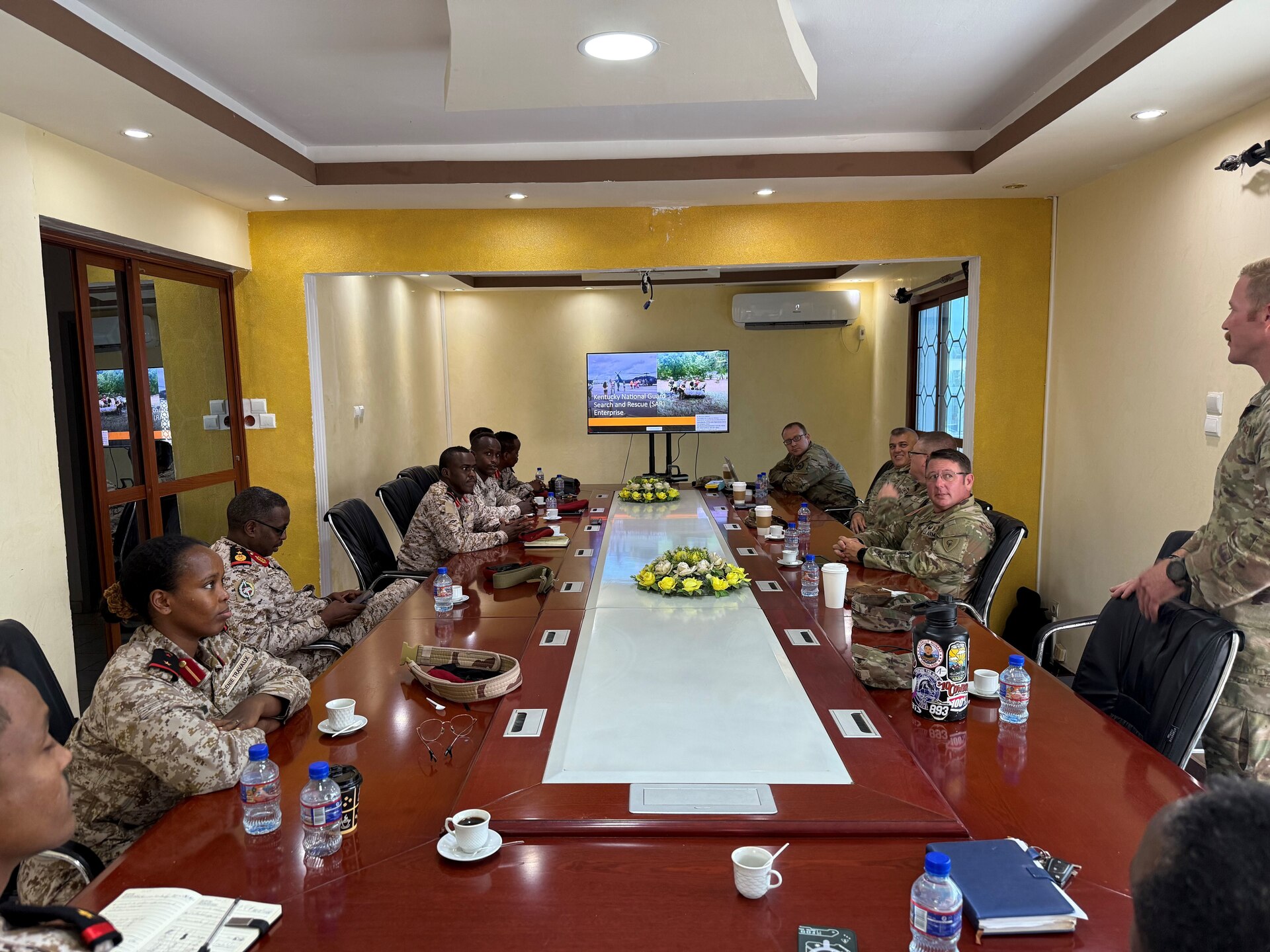 U.S. Air Force Master Sgt. Dylan Rhodes briefs Search and Rescue Enterprise to members of the Djiboutian Armed Forces in August 2025.