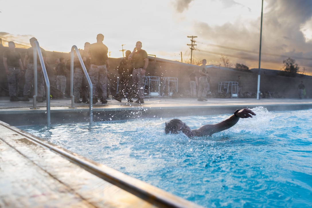 A U.S. Marine with 2nd Battalion, 4th Marine Regiment, 1st Marine Division conducts a 500 meter squad swim in the Toughest Bastard Field Competition on Marine Corps Base Camp Pendleton, California, Nov. 18, 2025. The event challenged the Marines’ endurance, teamwork, and mastery of infantry skills, reinforcing the battalion’s readiness and warfighting lethality. (U.S. Marine Corps photo by Lance Cpl. Christian Cutter)
