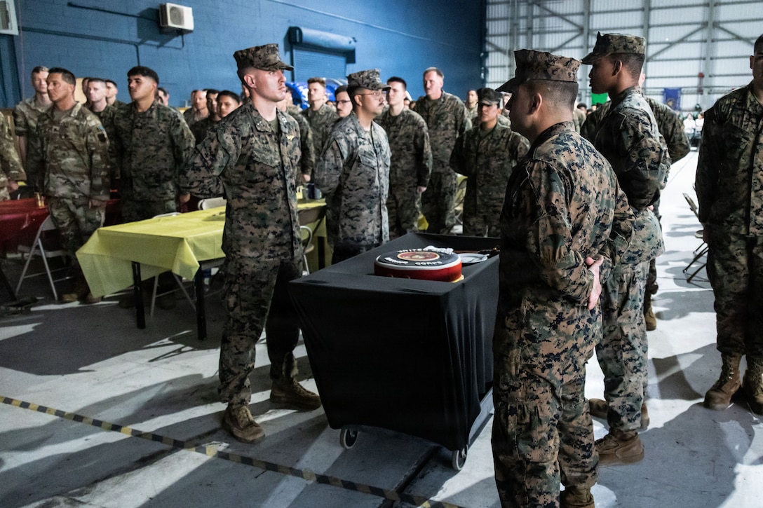U.S. Marines with Marine Fighter Attack Squadron (VMFA) 225, U.S. Marine Corps Forces, South, present the Marine Corps’ 250th Birthday cake at Jose Aponte de la Torre Airport in Ceiba, Puerto Rico, Nov. 14, 2025. U.S. military forces are deployed to the Caribbean in support of the U.S. Southern Command mission, Department of War-directed operations, and the president’s priorities to disrupt illicit drug trafficking and protect the homeland. (U.S. Marine Corps photo)