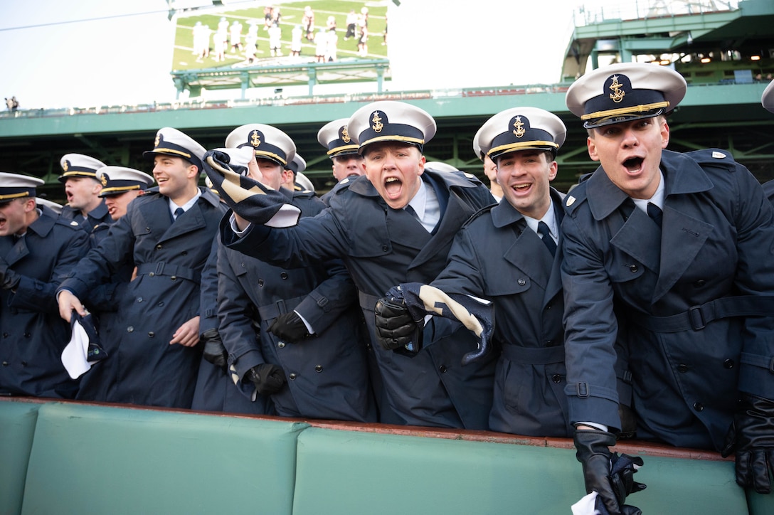 U.S. Coast Guard Academy football players cheer on their team from the stands at Fenway Park, Boston, Nov. 15, 2025. The location of the 54th Secretaries’ Cup is significant for being in a Major League stadium in the heart of New England, the birthplace of the U.S. Coast Guard. (U.S. Coast Guard photo by Petty Officer Third Class Leo Avila.)