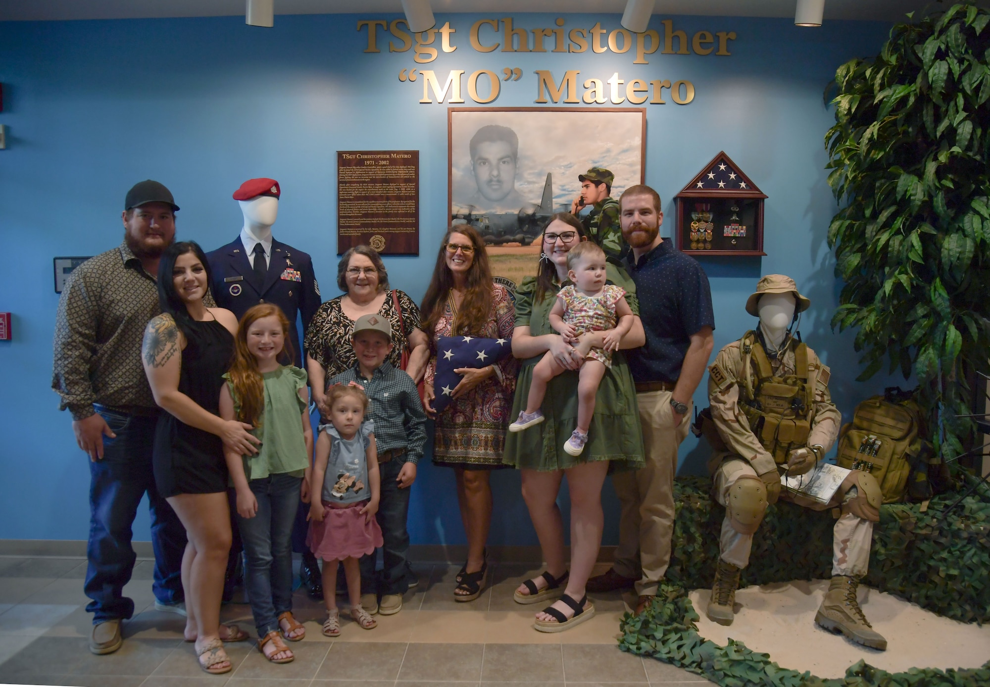 A group of people post for a photo