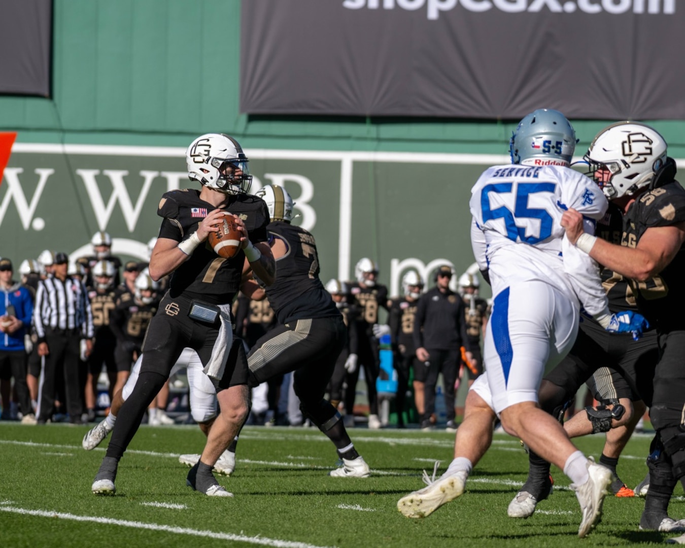 U.S. Coast Guard Academy football players execute a play against U.S. Merchant Marine football players during the 54th Secretaries' Cup at Fenway Park, Boston, Nov. 15, 2025. Fenway Park hosted the 54th Secretaries' Cup, giving both service academies a national stage to showcase their hard work and dedication. (U.S. Coast Guard photo by Petty Officer Third Class Leo Avila.)