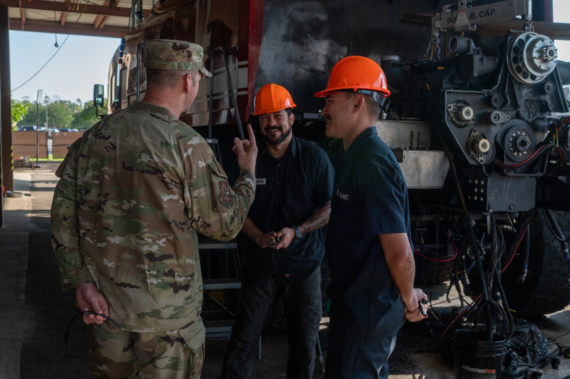 Men laugh and talk together.