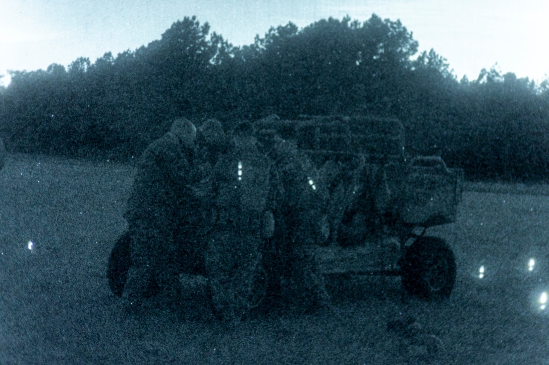 U.S. Marines with Combat Logistics Battalion (CLB) 8, 24th Marine Expeditionary Unit (MEU), prepare a Utility Task Vehicle during night helicopter support team operations at Marine Corps Base Camp Lejeune, North Carolina, Nov. 18, 2025. The 24th MEU is a composite Marine Air-Ground Task Force ready to respond to the nation’s call when needed. (U.S. Marine Corps Photo taken by Cpl. Daniel Childs)