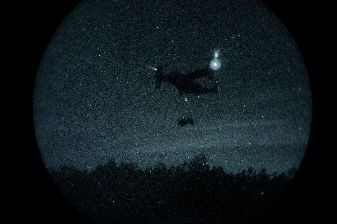 A U.S. Marine Corps MV-22B Osprey assigned to Marine Medium Tiltrotor Squadron (VMM) 365, 24th Marine Expeditionary Unit (MEU), prepares to offload a Utility Task Vehicle during night helicopter support team operations at Marine Corps Base Camp Lejeune, North Carolina, Nov. 18, 2025. The 24th MEU is a composite Marine Air-Ground Task Force ready to respond to the nation’s call when needed. (U.S. Marine Corps Photo taken by Cpl. Daniel Childs)