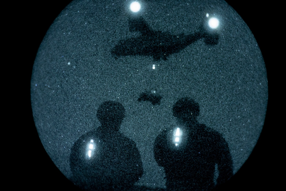 U.S. Marines with Combat Logistics Battalion (CLB) 8, 24th Marine Expeditionary Unit (MEU), observe an MV-22B Osprey assigned to Marine Medium Tiltrotor Squadron (VMM) 365, 24th MEU, hoist  a Utility Task Vehicle during night helicopter support team operations at Marine Corps Base Camp Lejeune, North Carolina, Nov. 18, 2025. The 24th MEU is a composite Marine Air-Ground Task Force ready to respond to the nation’s call when needed. (U.S. Marine Corps Photo taken by Cpl. Daniel Childs)