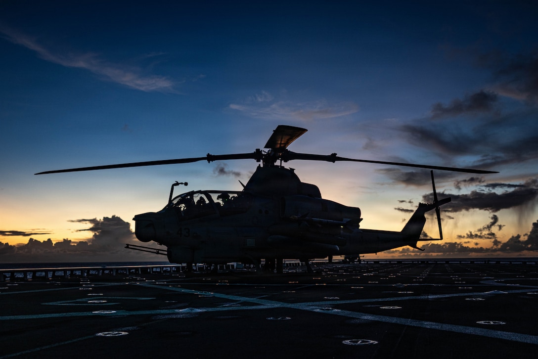U.S. Marines with Marine Medium Tiltrotor Squadron (VMM) 263 (Reinforced), 22nd Marine Expeditionary Unit (Special Operations Capable), prepare an AH-1Z Viper helicopter for flight operations aboard San Antonio-class amphibious transport dock USS Fort Lauderdale (LPD 28) while underway in the Caribbean Sea, Nov. 17, 2025. U.S. military forces are deployed to the Caribbean in support of the U.S. Southern Command mission, Department of War-directed operations, and the president's priorities to disrupt illicit drug trafficking and protect the homeland. (U.S. Marine Corps photo)
