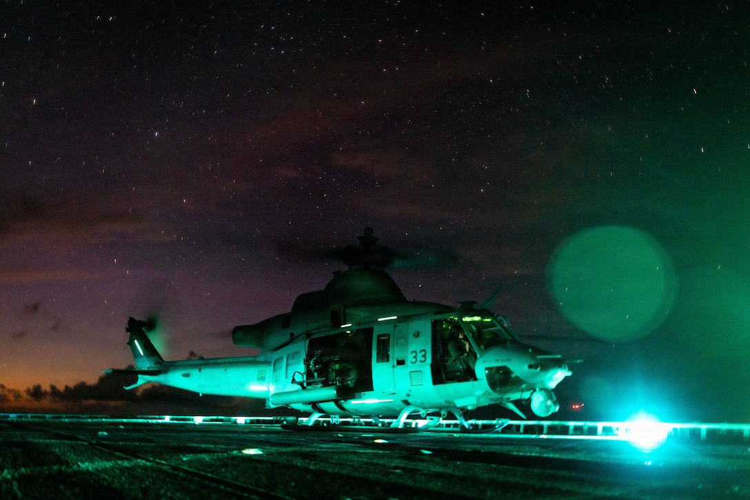 U.S. Marines with Marine Medium Tiltrotor Squadron (VMM) 263 (Reinforced), 22nd Marine Expeditionary Unit (Special Operations Capable), prepare an UH-1Y Venom helicopter for flight operations aboard San Antonio-class amphibious transport dock USS Fort Lauderdale (LPD 28) while underway in the Caribbean Sea, Nov. 17, 2025. U.S. military forces are deployed to the Caribbean in support of the U.S. Southern Command mission, Department of War-directed operations, and the president's priorities to disrupt illicit drug trafficking and protect the homeland. (U.S. Marine Corps photo)