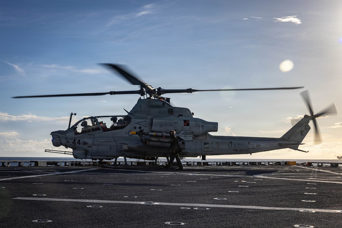 U.S. Marines with Marine Medium Tiltrotor Squadron (VMM) 263 (Reinforced), 22nd Marine Expeditionary Unit (Special Operations Capable), prepare an AH-1Z Viper helicopter for flight operations aboard San Antonio-class amphibious transport dock USS Fort Lauderdale (LPD 28) while underway in the Caribbean Sea, Nov. 17, 2025. U.S. military forces are deployed to the Caribbean in support of the U.S. Southern Command mission, Department of War-directed operations, and the president's priorities to disrupt illicit drug trafficking and protect the homeland. (U.S. Marine Corps photo)