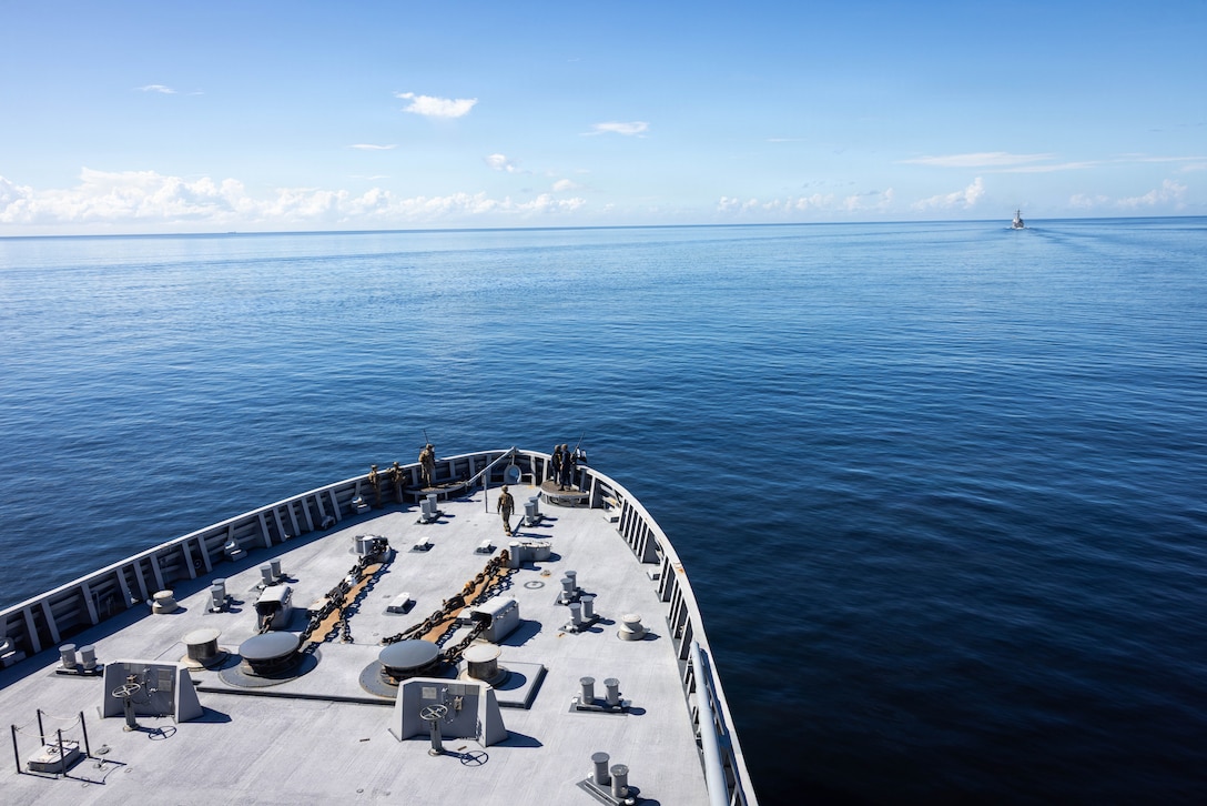 U.S. Marines with India Company, Battalion Landing Team 3/6, 22nd Marine Expeditionary Unit (Special Operations Capable), and Sailors assigned to San Antonio-class amphibious transport dock USS Fort Lauderdale (LPD 28) and Arleigh Burke-class guided-missile destroyer USS Stockdale (DDG 106), conduct a strait transit while underway in the Caribbean Sea, Nov. 18, 2025. U.S. military forces are deployed to the Caribbean in support of the U.S. Southern Command mission, Department of War-directed operations, and the president's priorities to disrupt illicit drug trafficking and protect the homeland. (U.S. Marine Corps photo)