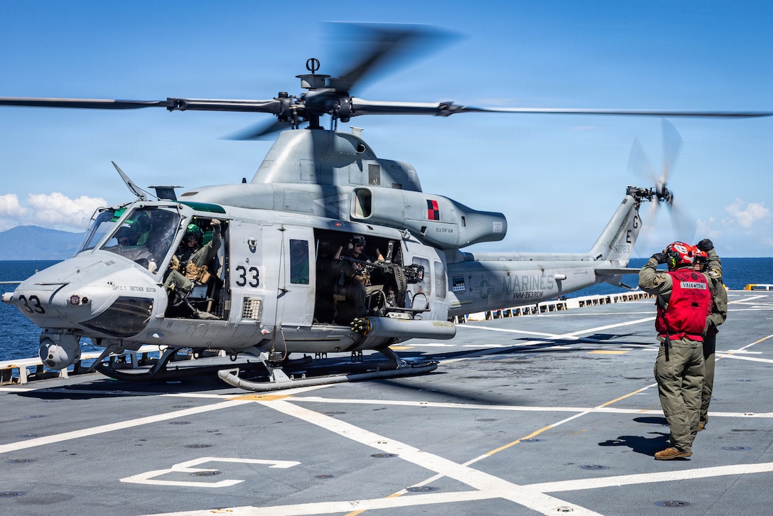 A U.S. Marine Corps UH-1Y Venom helicopter with Marine Medium Tiltrotor Squadron (VMM) 263 (Reinforced), 22nd Marine Expeditionary Unit (Special Operations Capable), prepares to take off from San Antonio-class amphibious transport dock USS Fort Lauderdale (LPD 28) during a strait transit while underway in the Caribbean Sea, Nov. 18, 2025. U.S. military forces are deployed to the Caribbean in support of the U.S. Southern Command mission, Department of War-directed operations, and the president's priorities to disrupt illicit drug trafficking and protect the homeland. (U.S. Marine Corps photo)