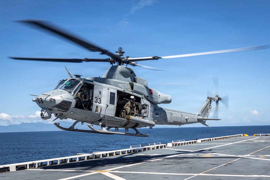 A U.S. Marine Corps UH-1Y Venom helicopter with Marine Medium Tiltrotor Squadron (VMM) 263 (Reinforced), 22nd Marine Expeditionary Unit (Special Operations Capable), takes off from San Antonio-class amphibious transport dock USS Fort Lauderdale (LPD 28) during a strait transit while underway in the Caribbean Sea, Nov. 18, 2025. U.S. military forces are deployed to the Caribbean in support of the U.S. Southern Command mission, Department of War-directed operations, and the president's priorities to disrupt illicit drug trafficking and protect the homeland. (U.S. Marine Corps photo)