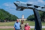 U.S. Air Force Senior Airman Janelee Roches, 2nd Comptroller Squadron commander’s support staff force management technician, takes a group photo with John and Melody Rodland, at Barksdale Air Force Base, Louisiana, Oct. 12, 2025. John and Melody volunteered for Barksdale’s Adopt an Airman support program which offers Airmen at Barksdale a new support system by matching with local volunteer family members, gaining a new home away from home. (U.S. Air Force photo by Airman 1st Class Preston Crawford)