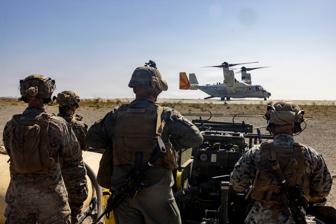 U.S. Marines with Marine Wing Support Squadron 372, Marine Aircraft Group 39, 3rd Marine Aircraft Wing, stand ready to operate a Forward Arming and Refueling Point during the Naval Aviation Warfighting Development Center’s joint training at Marine Corps Base Camp Pendleton, California, Oct. 28, 2025. During the training, Marines with MWSS-372 assisted Sailors with Helicopter Sea Combat Squadron 5, Helicopter Maritime Strike Squadron 40, and Fleet Logistics Multi-Mission Squadron 40 in establishing a FARP. NAWDC 25.3 serves as the cornerstone of naval aviation’s combat readiness—where warfighters refine their skills to enhance lethality, effectiveness, and mission success in high-threat environments. (U.S. Marine Corps photo by Lance Cpl. Jackson Rush)