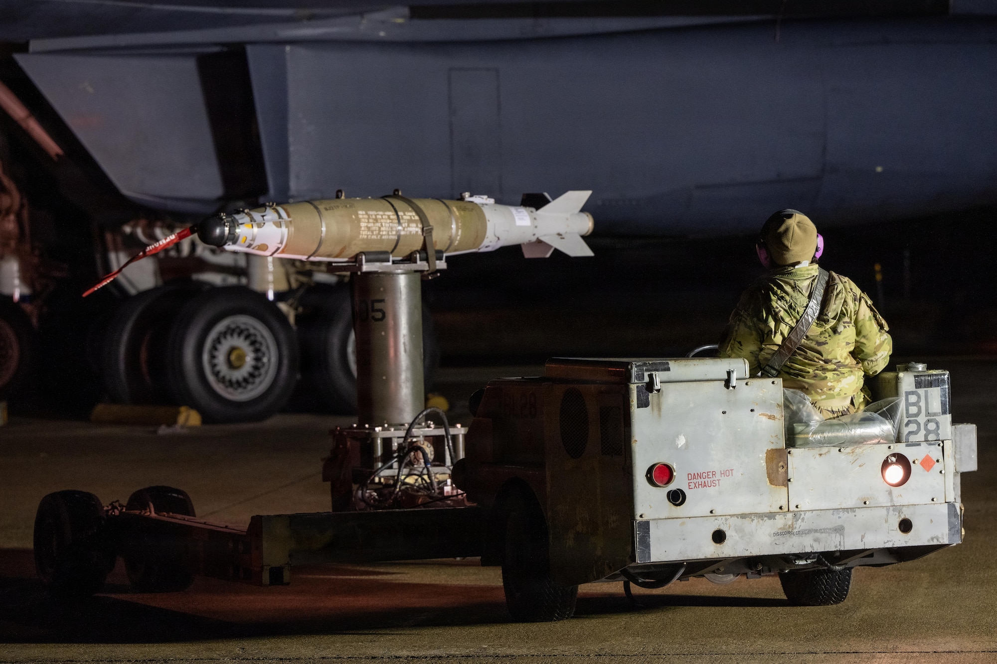 Weapons sit on the flightline before being loaded onto a B-1B Lancer