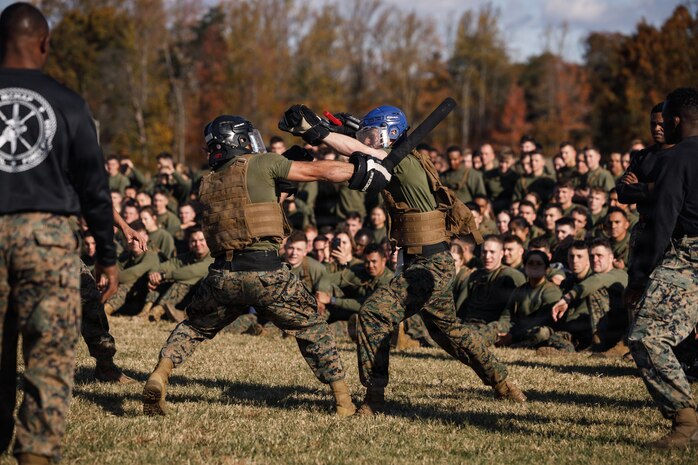 U.S. Marines with The Basic School, Training Command, compete in a weapons free-sparring event during a field meet at Marine Corps Base Quantico, Virginia, Oct. 31, 2025.  During the field meet, Marines with TBS participated in physical training and competitions to build camaraderie and celebrate the Marine Corps' 250th Birthday. (U.S. Marine Corps photo by Cpl. Joshua Barker)