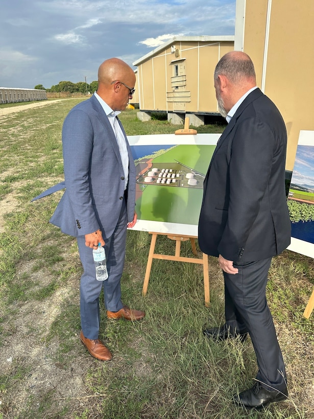 RDML Bresnihan (left) tours the site of the future Port Moresby DFSP and is presented with designs of the facility once constructed and operational.