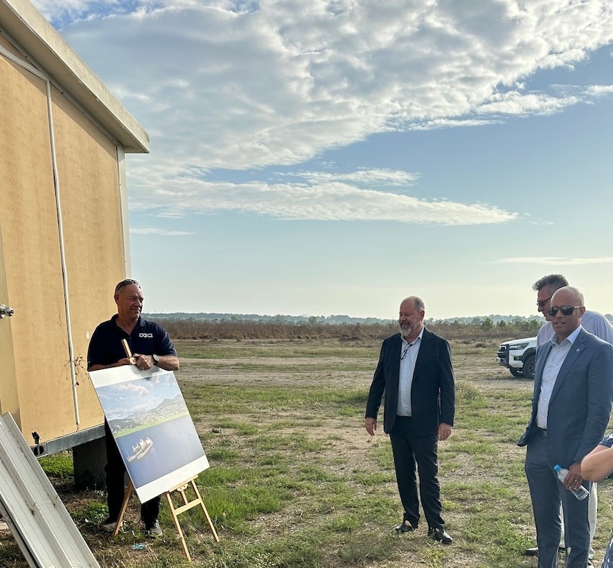 RDML Bresnihan (right) tours the site of the future Port Moresby DFSP and is presented with designs of the facility once constructed and operational.
