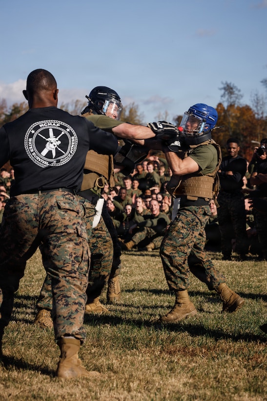 U.S. Marines with The Basic School, Training Command, compete in a weapons free-sparring event during a field meet at Marine Corps Base Quantico, Virginia, Oct. 31, 2025.  During the field meet, Marines with TBS participated in physical training and competitions to build camaraderie and celebrate the Marine Corps' 250th Birthday. (U.S. Marine Corps photo by Cpl. Joshua Barker)