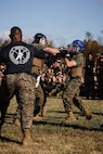U.S. Marines with The Basic School, Training Command, compete in a weapons free-sparring event during a field meet at Marine Corps Base Quantico, Virginia, Oct. 31, 2025.  During the field meet, Marines with TBS participated in physical training and competitions to build camaraderie and celebrate the Marine Corps' 250th Birthday. (U.S. Marine Corps photo by Cpl. Joshua Barker)