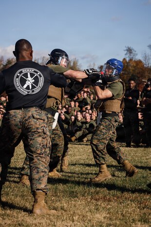 U.S. Marines with The Basic School, Training Command, compete in a weapons free-sparring event during a field meet at Marine Corps Base Quantico, Virginia, Oct. 31, 2025.  During the field meet, Marines with TBS participated in physical training and competitions to build camaraderie and celebrate the Marine Corps' 250th Birthday. (U.S. Marine Corps photo by Cpl. Joshua Barker)