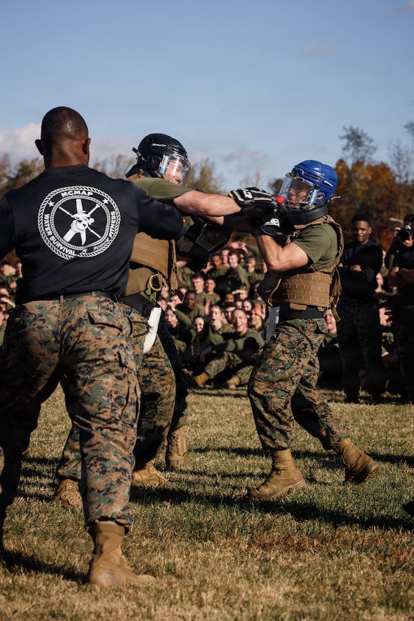 U.S. Marines with The Basic School, Training Command, compete in a weapons free-sparring event during a field meet at Marine Corps Base Quantico, Virginia, Oct. 31, 2025.  During the field meet, Marines with TBS participated in physical training and competitions to build camaraderie and celebrate the Marine Corps' 250th Birthday. (U.S. Marine Corps photo by Cpl. Joshua Barker)