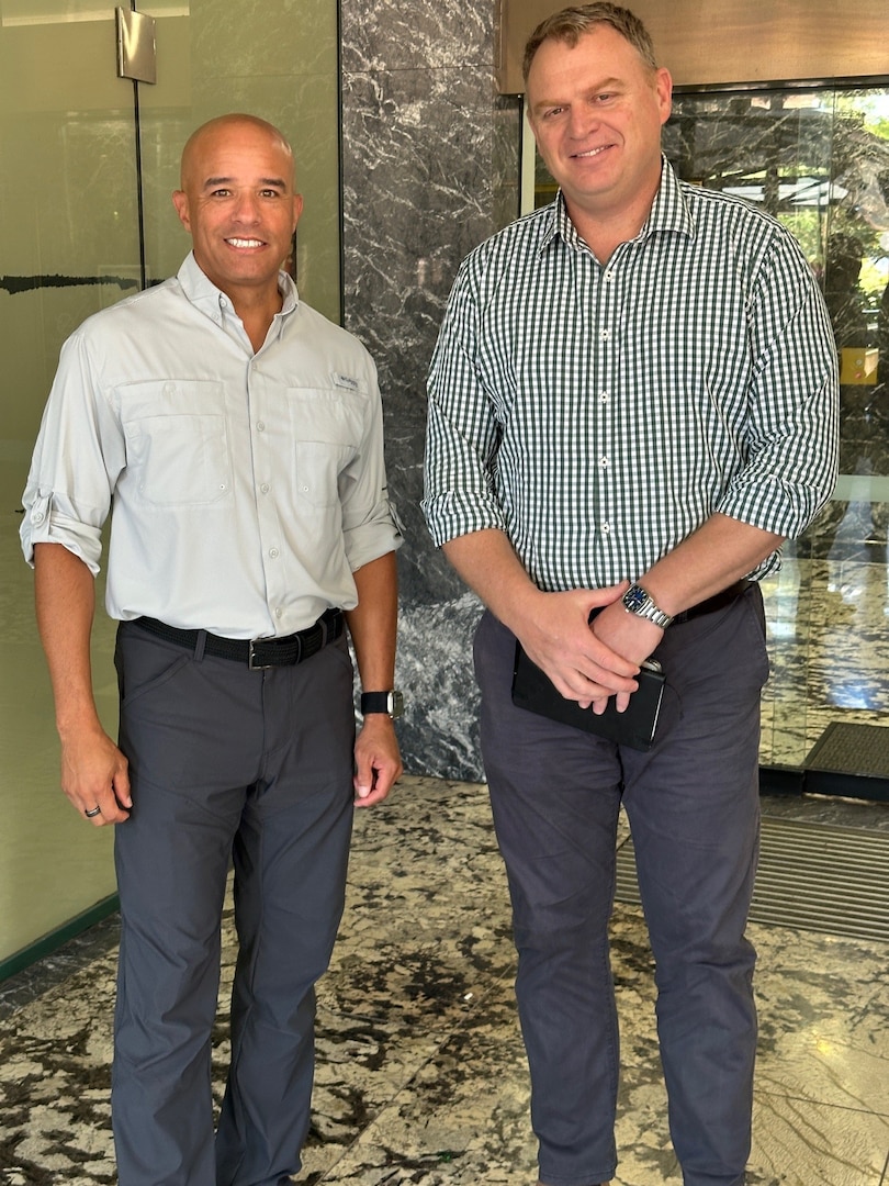 RDML Bresnihan (left) is greeted by Australian Defense Force Brigadier Mark Baldock outside the Northern Territory Defence Office.