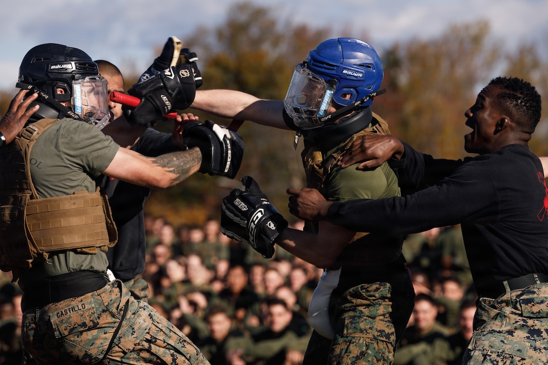 U.S. Marines with The Basic School, Training Command, compete in a weapons free-sparring event during a field meet at Marine Corps Base Quantico, Virginia, Oct. 31, 2025.  During the field meet, Marines with TBS participated in physical training and competitions to build camaraderie and celebrate the Marine Corps' 250th Birthday. (U.S. Marine Corps photo by Cpl. Joshua Barker)
