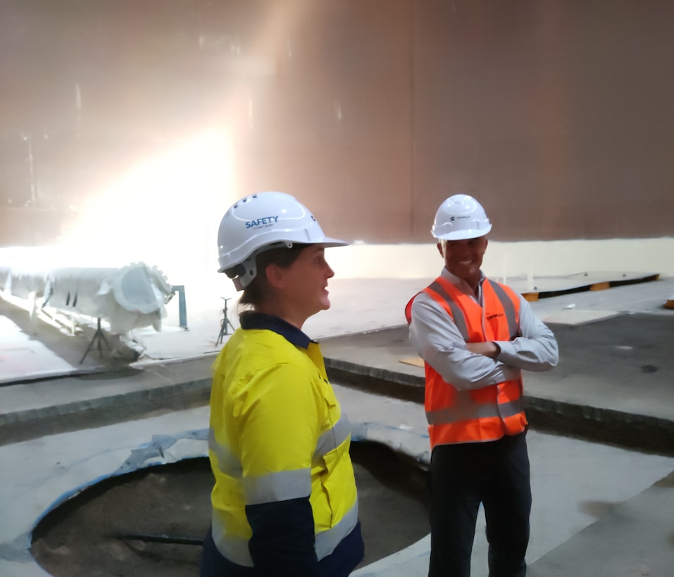 RDML Bresnihan examines the construction of a large storage tank at the site of a future fueling facility near Port Darwin.