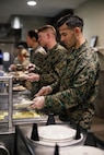 U.S. Marine Corps Gunnery Sgt. Edwin Omanahernandez, the staff noncommissioned officer in charge of Company D, Basic Officer Course 4-25, The Basic School, serves food during the Warrior’s Breakfast at TBS, Marine Corps Base Quantico, Virginia, Nov. 20, 2025. The Warrior’s breakfast follows the Warfighting Field Exercise, which serves as the culminating event at TBS, evaluating students’ proficiency in decision-making, small-unit tactics, and leadership as they operate under sustained physical and mental pressure in a realistic warfighting scenario. (U.S. Marine Corps photo by Cpl. Joshua Barker)