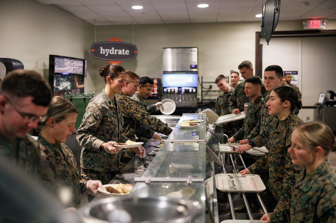 U.S. Marines with Company D, Basic Officer Course 4-25, The Basic School participate in the Warrior’s Breakfast at TBS, on Marine Corps Base Quantico, Virginia, Nov. 20, 2025. The Warrior’s breakfast follows the Warfighting Field Exercise, which serves as the culminating event at TBS, evaluating students’ proficiency in decision-making, small-unit tactics, and leadership as they operate under sustained physical and mental pressure in a realistic warfighting scenario. (U.S. Marine Corps photo by Cpl. Joshua Barker)
