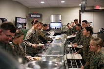 U.S. Marines with Company D, Basic Officer Course 4-25, The Basic School participate in the Warrior’s Breakfast at TBS, on Marine Corps Base Quantico, Virginia, Nov. 20, 2025. The Warrior’s breakfast follows the Warfighting Field Exercise, which serves as the culminating event at TBS, evaluating students’ proficiency in decision-making, small-unit tactics, and leadership as they operate under sustained physical and mental pressure in a realistic warfighting scenario. (U.S. Marine Corps photo by Cpl. Joshua Barker)