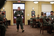 U.S. Marine Corps Lt. Col. Michael Breslin, director of warfighting, The Basic School, Training Command, speaks during the Company D’s Warrior’s Breakfast at TBS, on Marine Corps Base Quantico, Virginia, Nov. 20, 2025. The Warrior’s breakfast follows the Warfighting Field Exercise, which serves as the culminating event at TBS, evaluating students’ proficiency in decision-making, small-unit tactics, and leadership as they operate under sustained physical and mental pressure in a realistic warfighting scenario. (U.S. Marine Corps photo by Cpl. Joshua Barker)