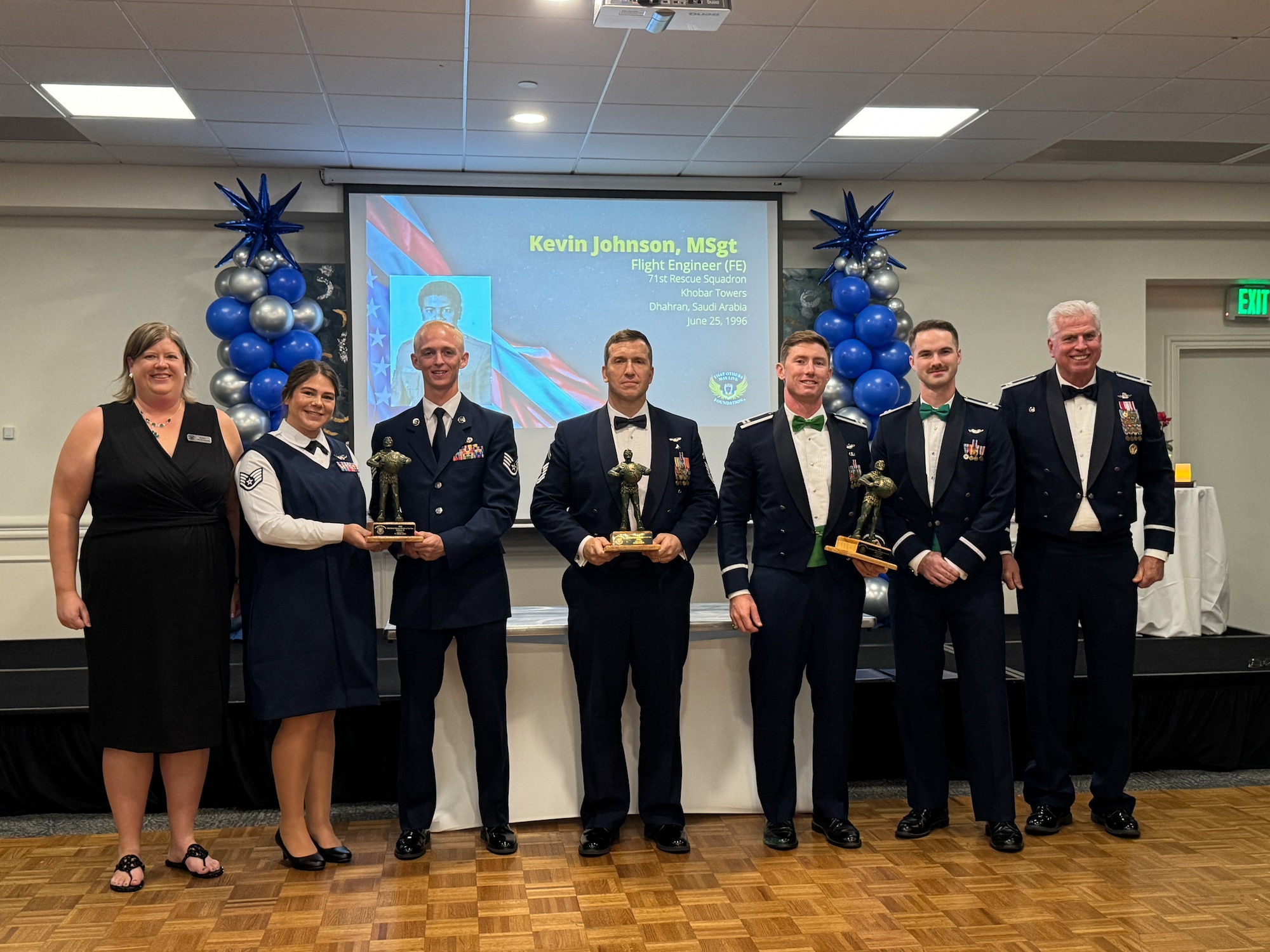 Group of people pose for a photo.