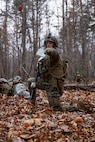 A U.S. Marine Corps student with Company D, Basic Officer Course 4-25, directs other Marines during the Warfighting Field Exercise at Marine Corps Base Quantico, Virginia, Nov. 19, 2025. The WARFEX serves as the culminating event at TBS, evaluating students’ proficiency in decision-making, small-unit tactics, and leadership as they operate under sustained physical and mental pressure in a realistic warfighting scenario. (U.S. Marine Corps photo by Cpl. Joshua Barker)