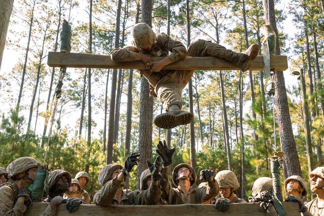 Recruits with November Company, 3rd Recruit Training Battalion, complete an obstacle during the Crucible, on Marine Corps Recruit Depot Parris Island, S.C., Sept. 19, 2025. The Crucible is the 54-hour culminating event of recruit training, putting recruits' physical and mental resilience to the ultimate test, before earning the title, United States Marine. (U.S. Marine Corps photo by Lance Cpl. Jacob Claudell)