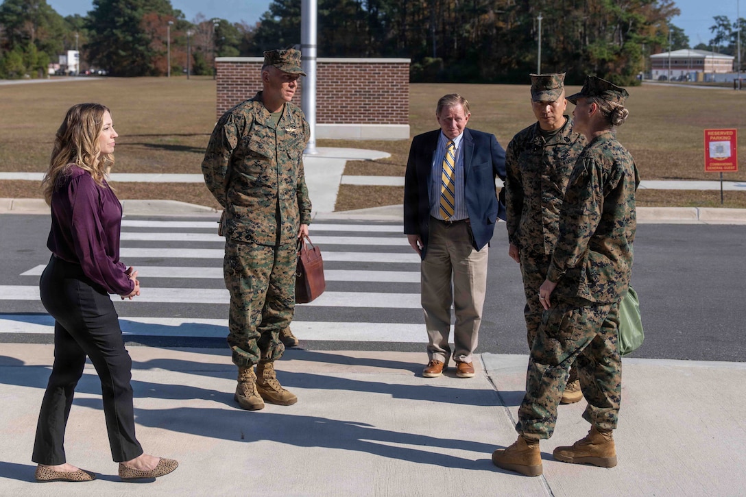 U.S. Marine Corps Lt. Gen. Eric Austin, Combat Development and Integration deputy commandant, center left, speaks with Brig. Gen. Maura M. Hennigan, 2nd Marine Logistics Group commanding general, at Marine Corps Base Camp Lejeune, North Carolina, Nov. 20, 2025. Austin met with leaders of 2nd MLG to speak about force design and 2nd MLG’s capabilities and efforts to innovate as well as touring the II Marine Expeditionary Force innovation campus. (U.S. Marine Corps photo by Sgt. Rafael Brambila-Pelayo)