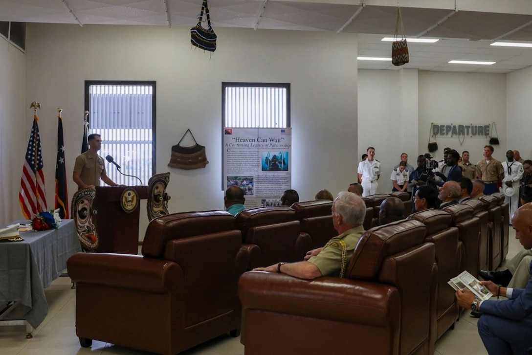 U.S. Marine Corps Lt. Col. Jeremy Smith, the Indo-Pacific deputy director with the Defense POW/MIA Accounting Agency, gives his opening remarks before a repatriation ceremony Sept. 24, 2025, in Port Moresby, Papua New Guinea. RDML Bresnihan (right) attended the ceremony marking the official transfer of possible remains discovered during a recovery mission in the country.