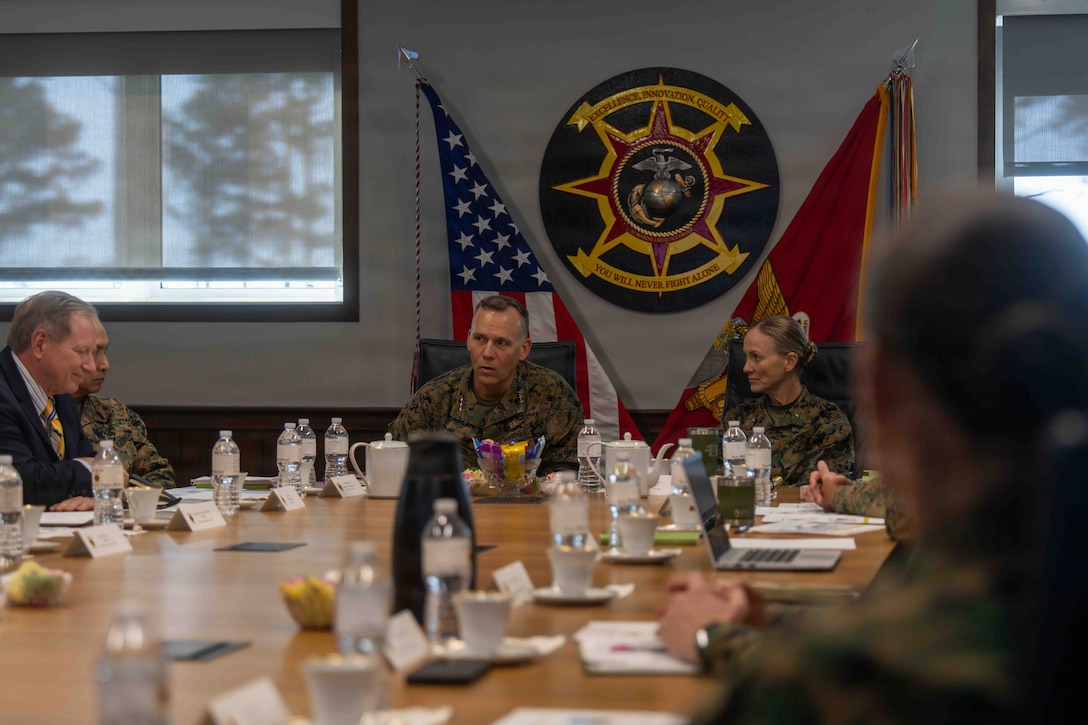 U.S. Marine Corps Lt. Gen. Eric Austin, Combat Development and Integration deputy commandant, center left, speaks with Marines, Sailors, and contractors from 2nd Marine Logistics Group at Marine Corps Base Camp Lejeune, North Carolina, Nov. 20, 2025. Austin met with leaders of 2nd MLG to speak about force design and 2nd MLG’s capabilities and efforts to innovate as well as touring the II Marine Expeditionary Force innovation campus. (U.S. Marine Corps photo by Sgt. Rafael Brambila-Pelayo)